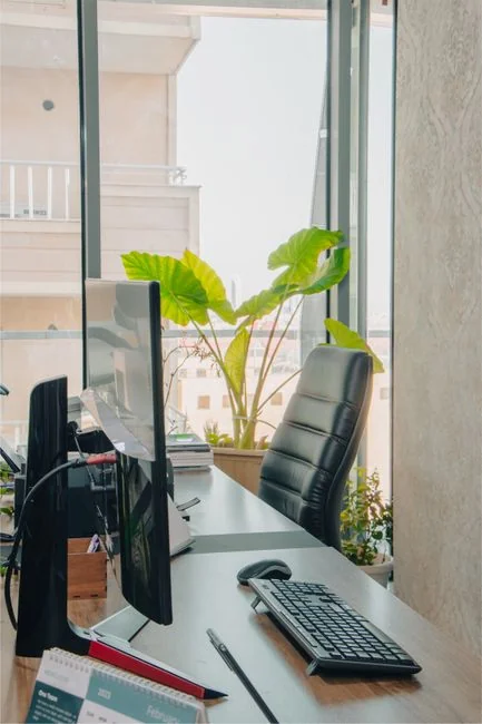 about-01 A focused designer works on a user-centric project in a modern office environment.